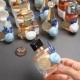 بكج توزيعات عطور 25 قطعة + هدية ستاند خشبي بكج توزيعات عطور 25 قطعة + هدية ستاند خشبي
